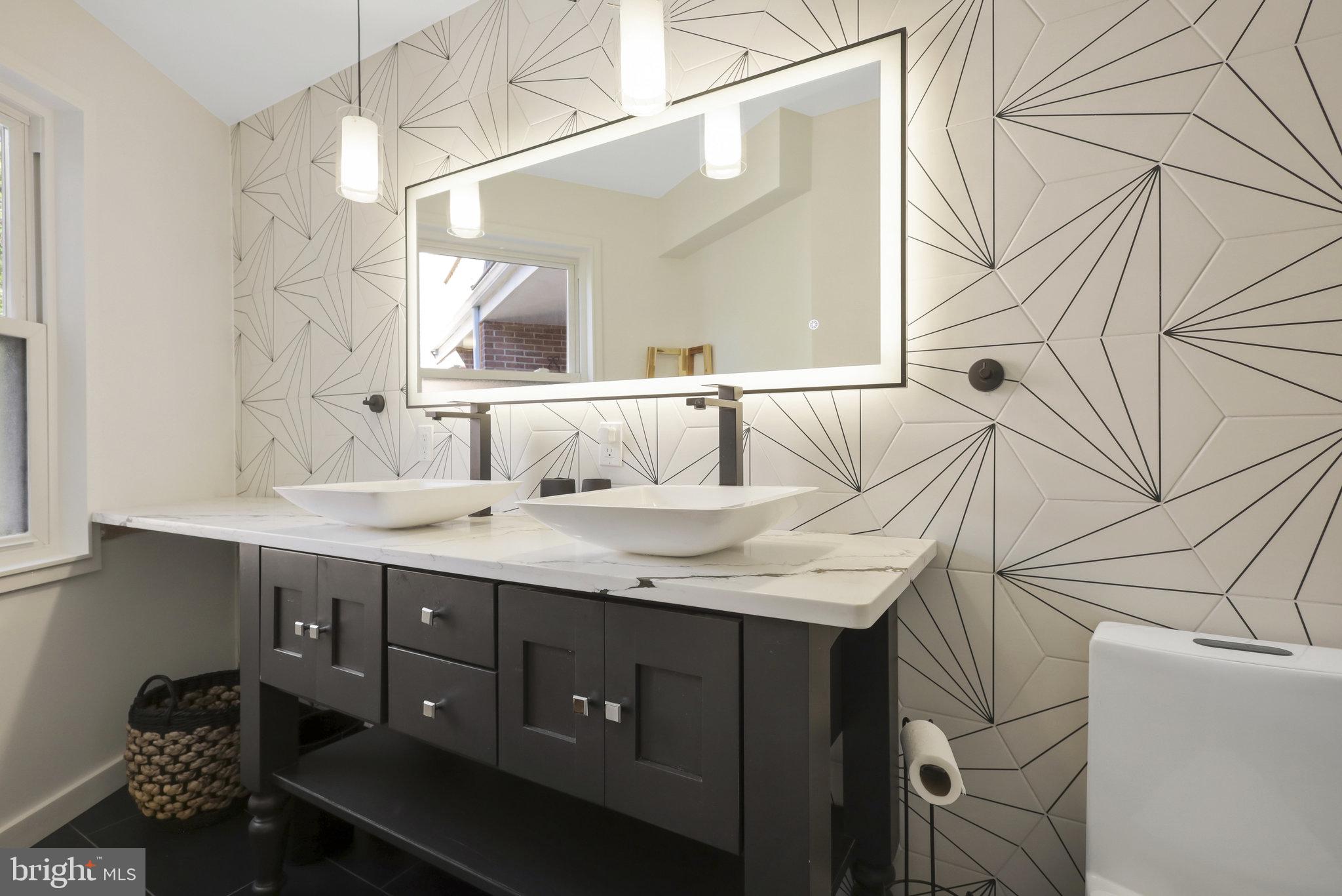 116 Commerce Street Alexandria, VA 22314 - Photo 16 of 50 Sleek modern bathroom with geometric flair.