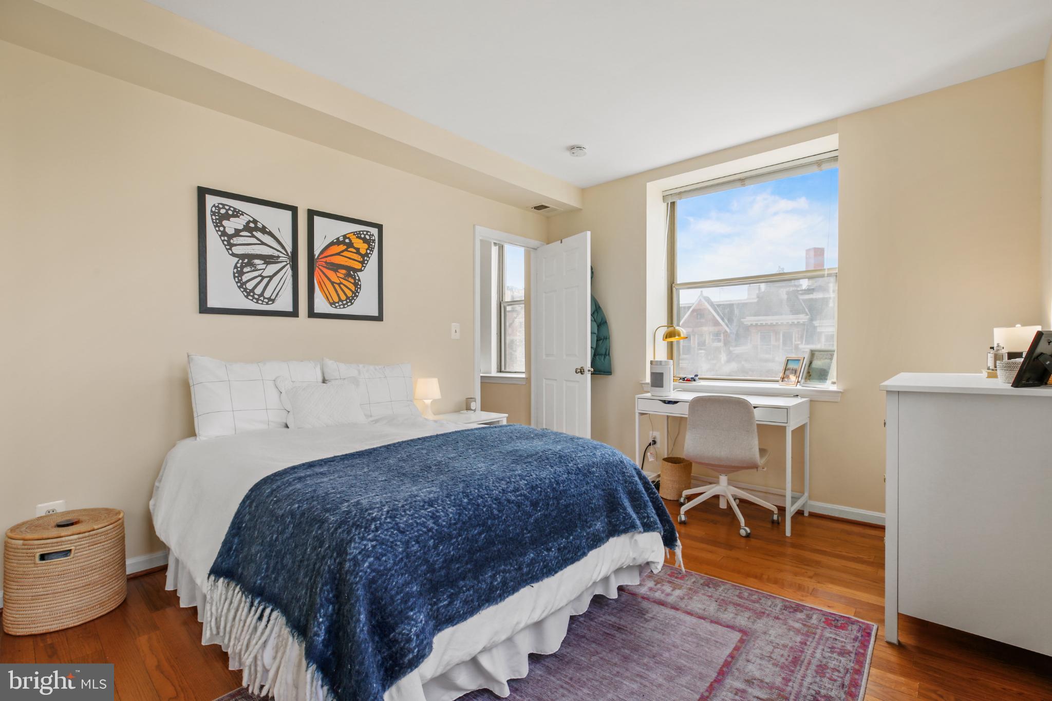 1920 S Street Northwest, Unit 404 Washington, DC 20009 - Photo 14 of 25 a bedroom with a bed and a table