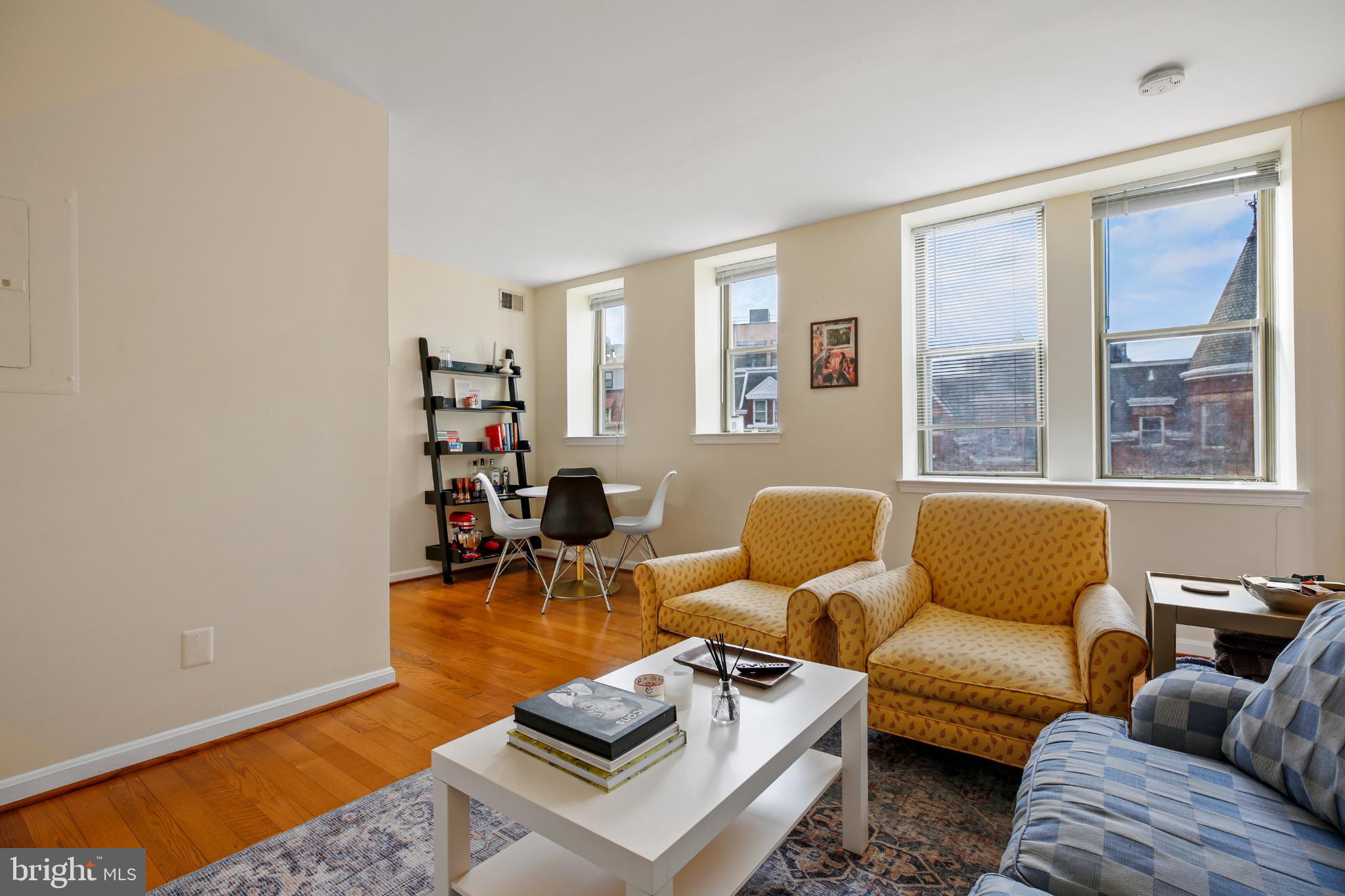 1920 S Street Northwest, Unit 404 Washington, DC 20009 - Photo 2 of 25 a living room with furniture and a window