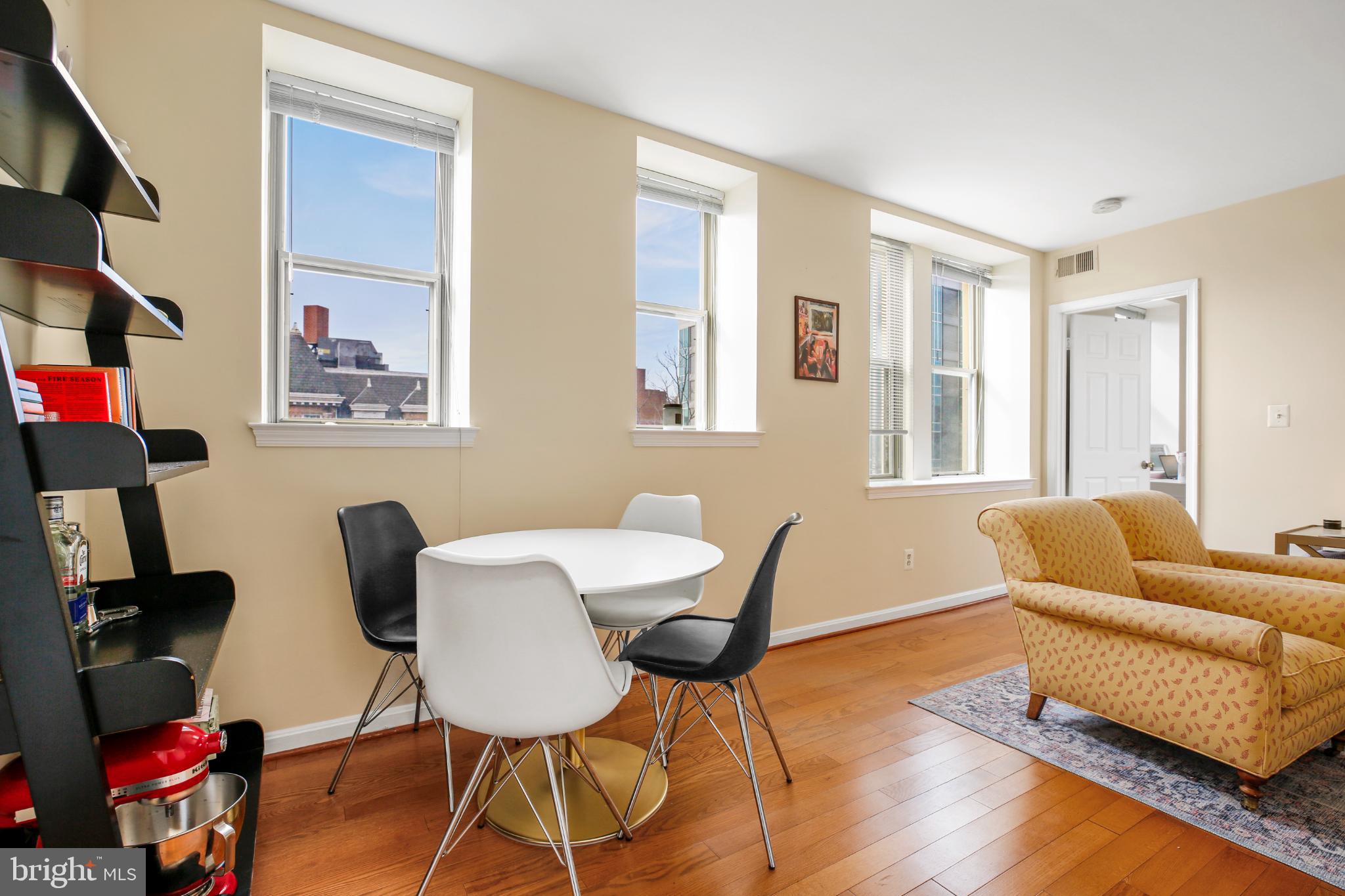 1920 S Street Northwest, Unit 404 Washington, DC 20009 - Photo 3 of 25 a living room with furniture and a window