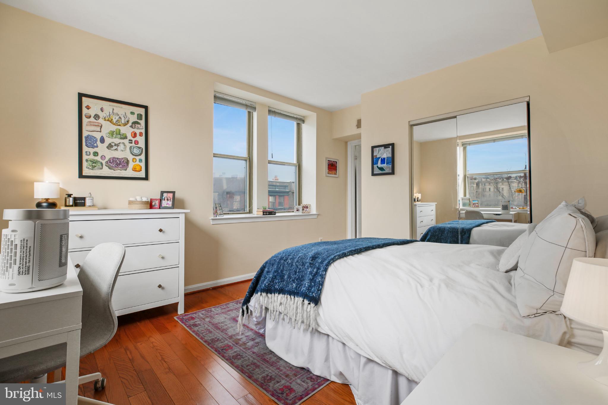 1920 S Street Northwest, Unit 404 Washington, DC 20009 - Photo 4 of 25 a bedroom with a bed and a window