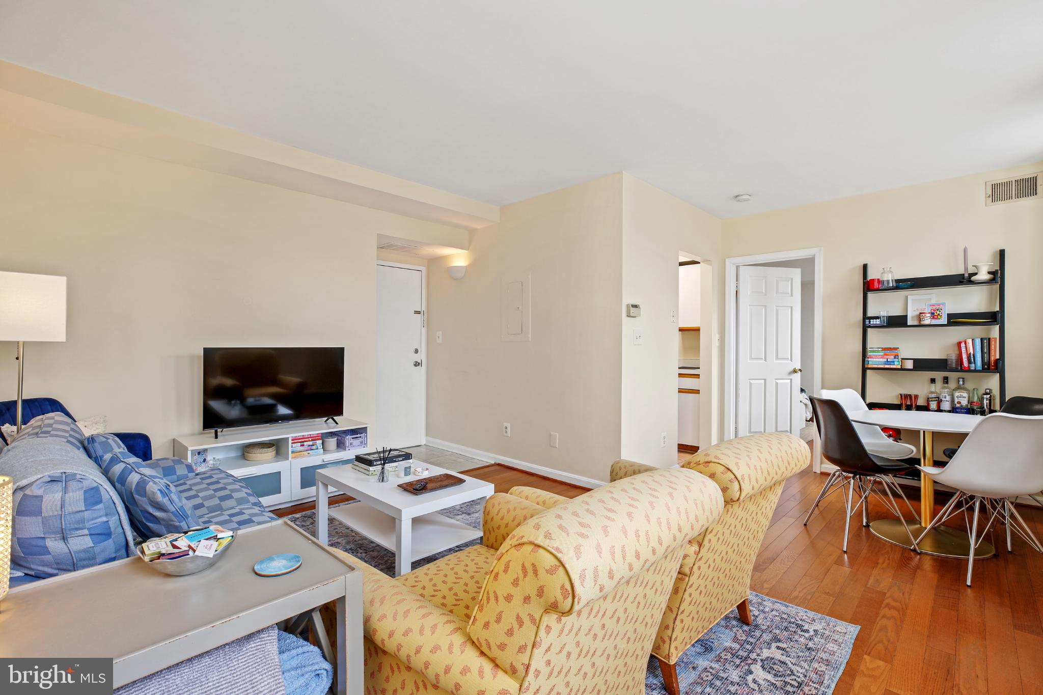 1920 S Street Northwest, Unit 404 Washington, DC 20009 - Photo 7 of 25 a living room with furniture and a flat screen tv