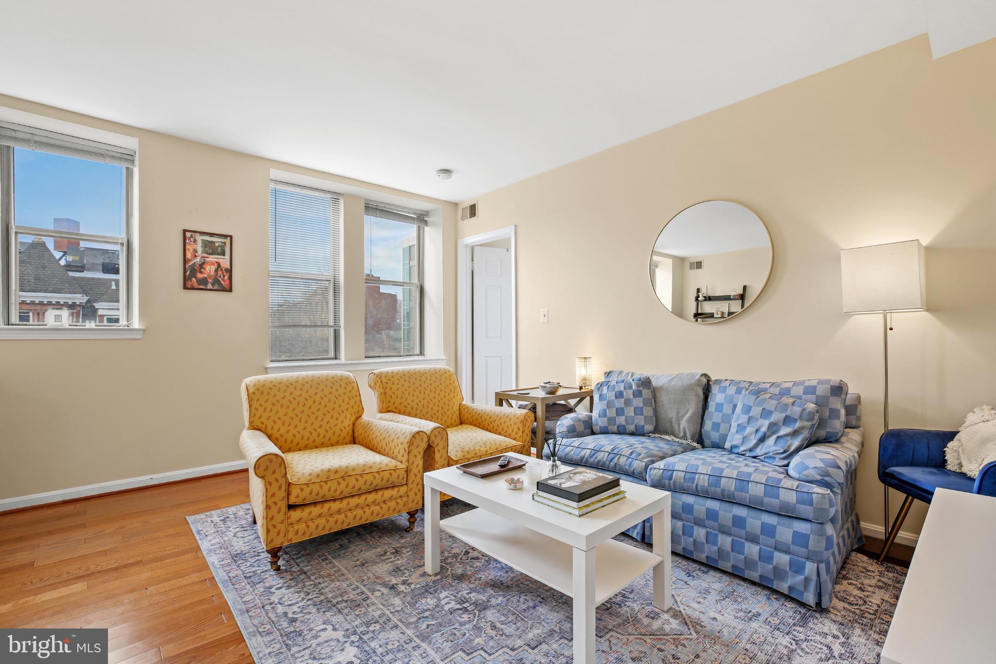 1920 S Street Northwest, Unit 404 Washington, DC 20009 - Photo 8 of 25 a living room with furniture and a window