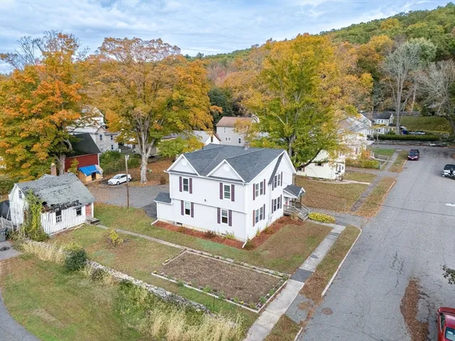 an aerial view of residential houses with outdoor space