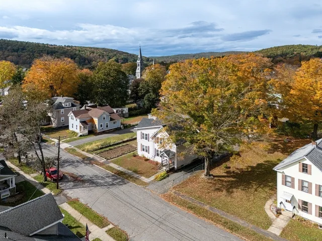 a view of swimming pool with seating area and roof
