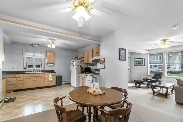 a kitchen with sink cabinets and dining table