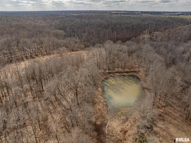 an aerial view of a houses with a lake view