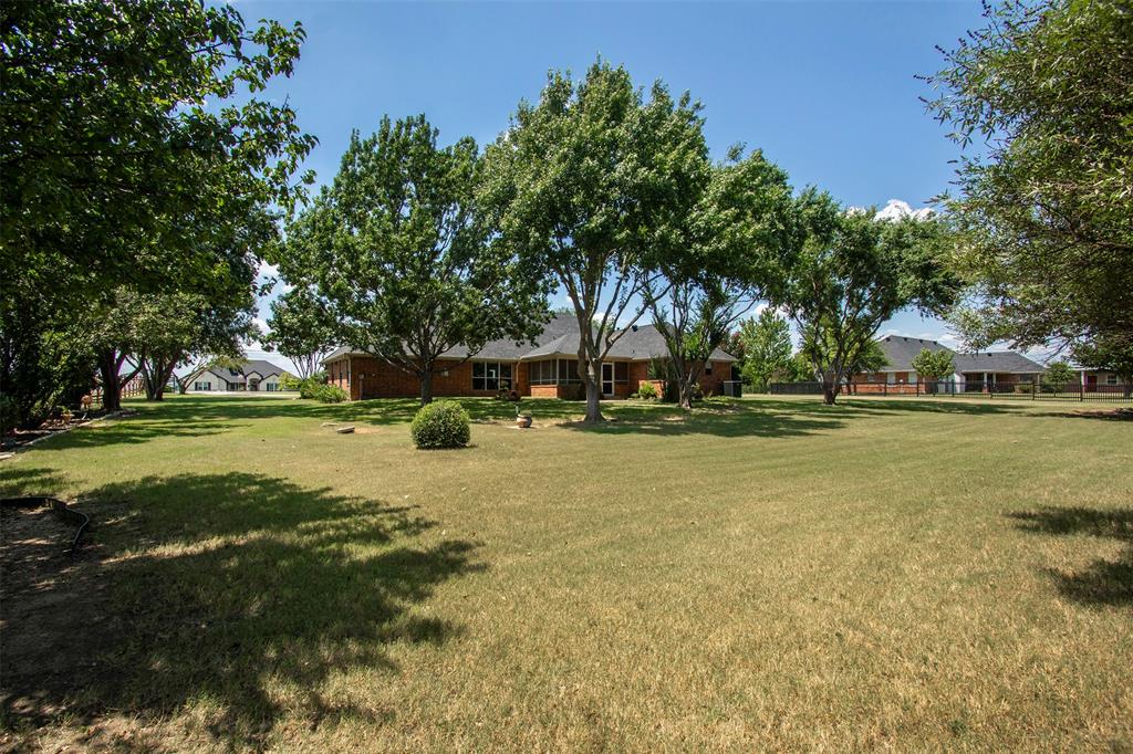 100 Durning Road Van Alstyne, TX 75495 - Photo 23 of 28 Private backyard with mature trees