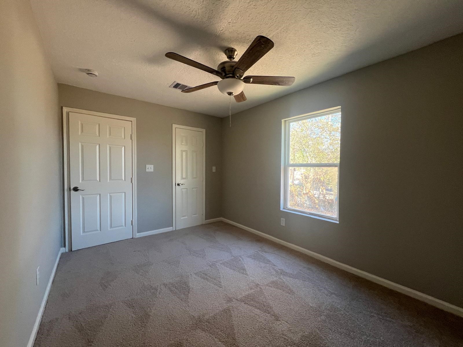 7106 Summer Lane Rosharon, TX 77583 - Photo 11 of 13 a view of an empty room with a window