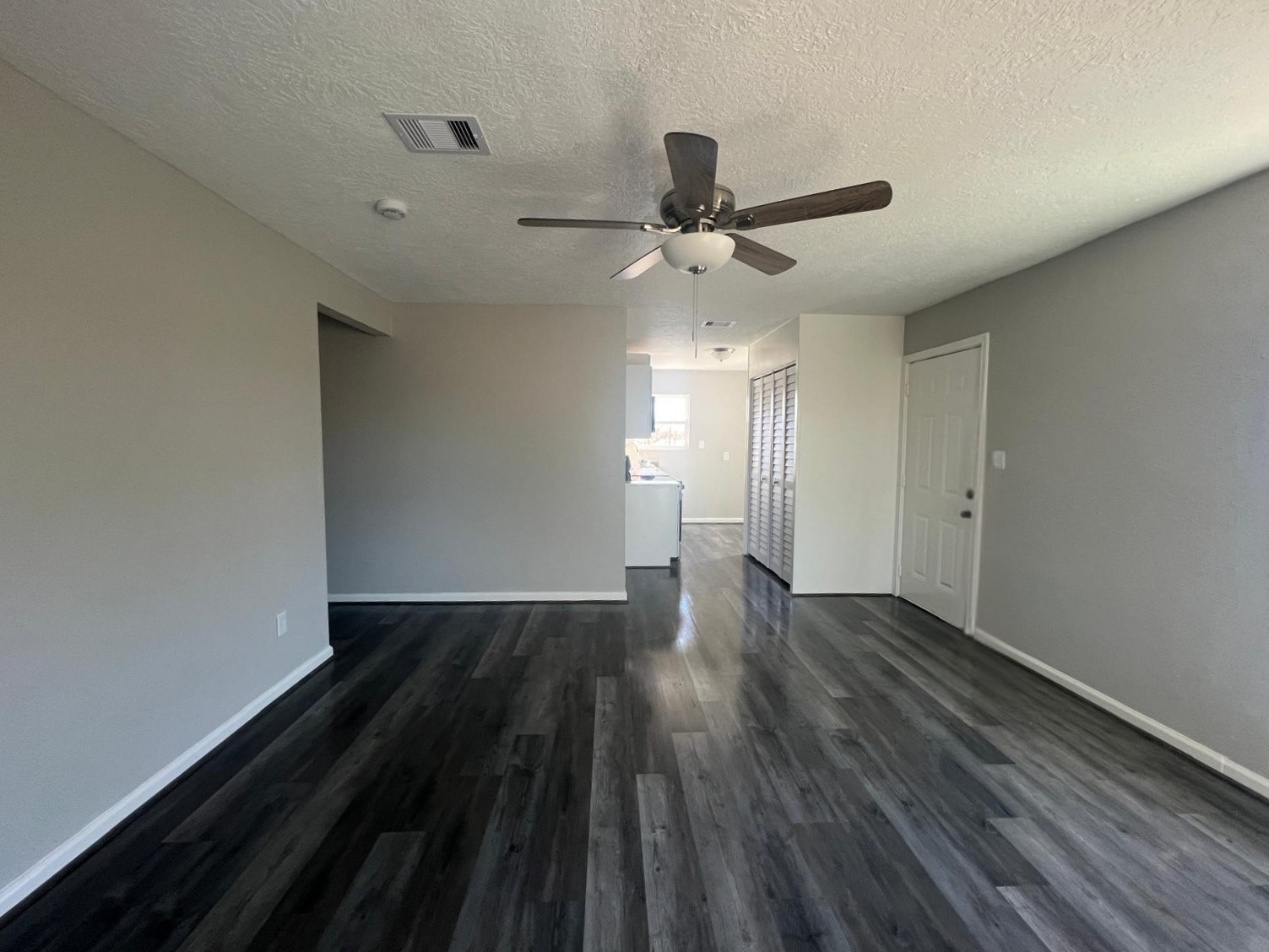 7106 Summer Lane Rosharon, TX 77583 - Photo 2 of 13 wooden floor in an empty room with a window
