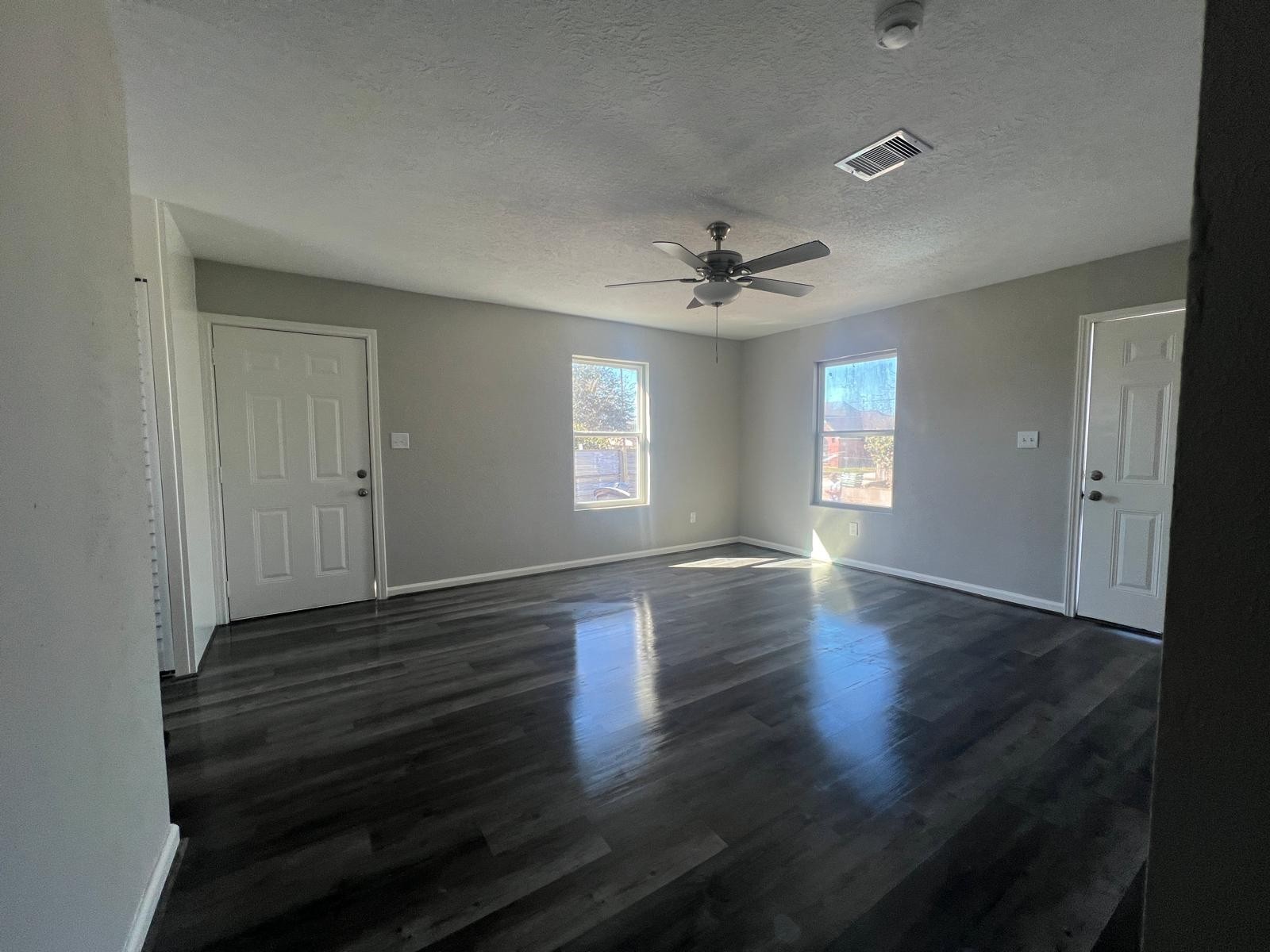 7106 Summer Lane Rosharon, TX 77583 - Photo 3 of 13 a view of an empty room with wooden floor and a window