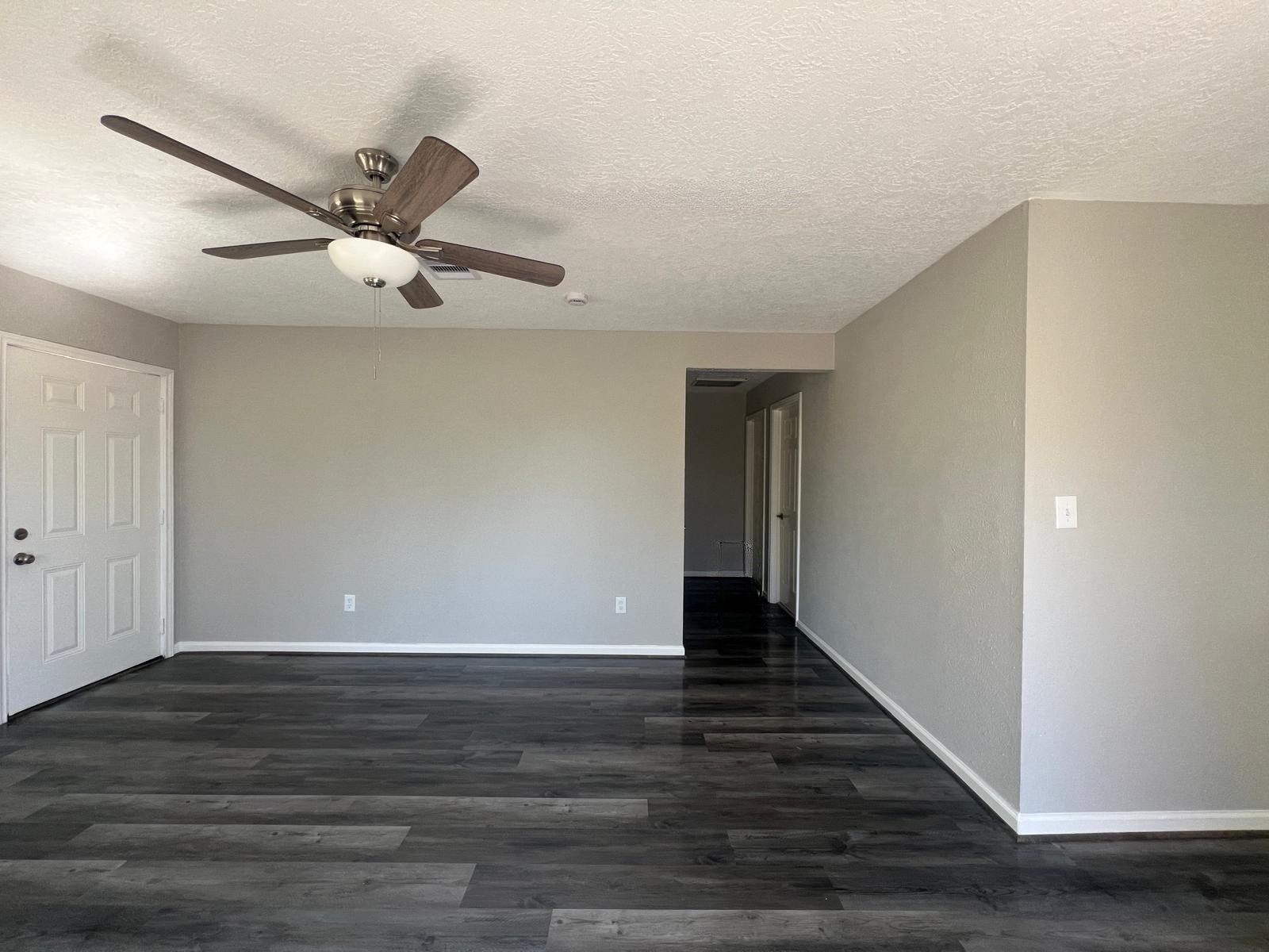 7106 Summer Lane Rosharon, TX 77583 - Photo 4 of 13 a view of an empty room with wooden floor