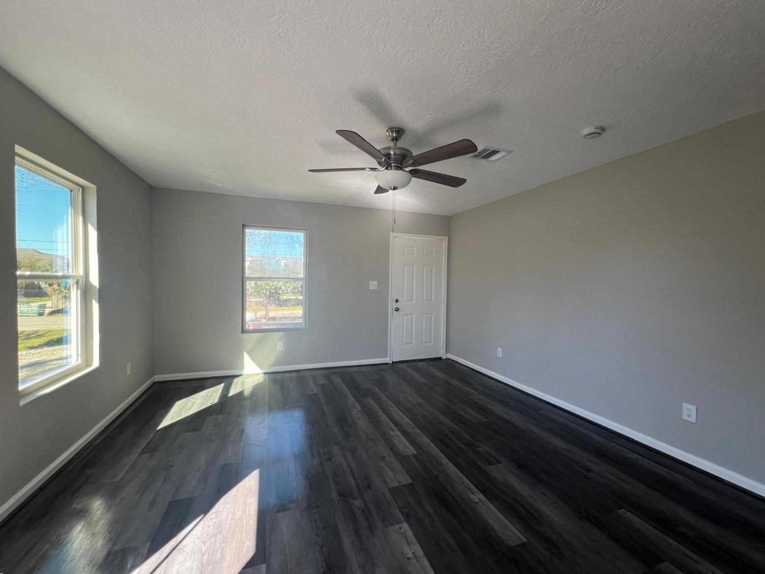 7106 Summer Lane Rosharon, TX 77583 - Photo 5 of 13 a view of an empty room with wooden floor and a window