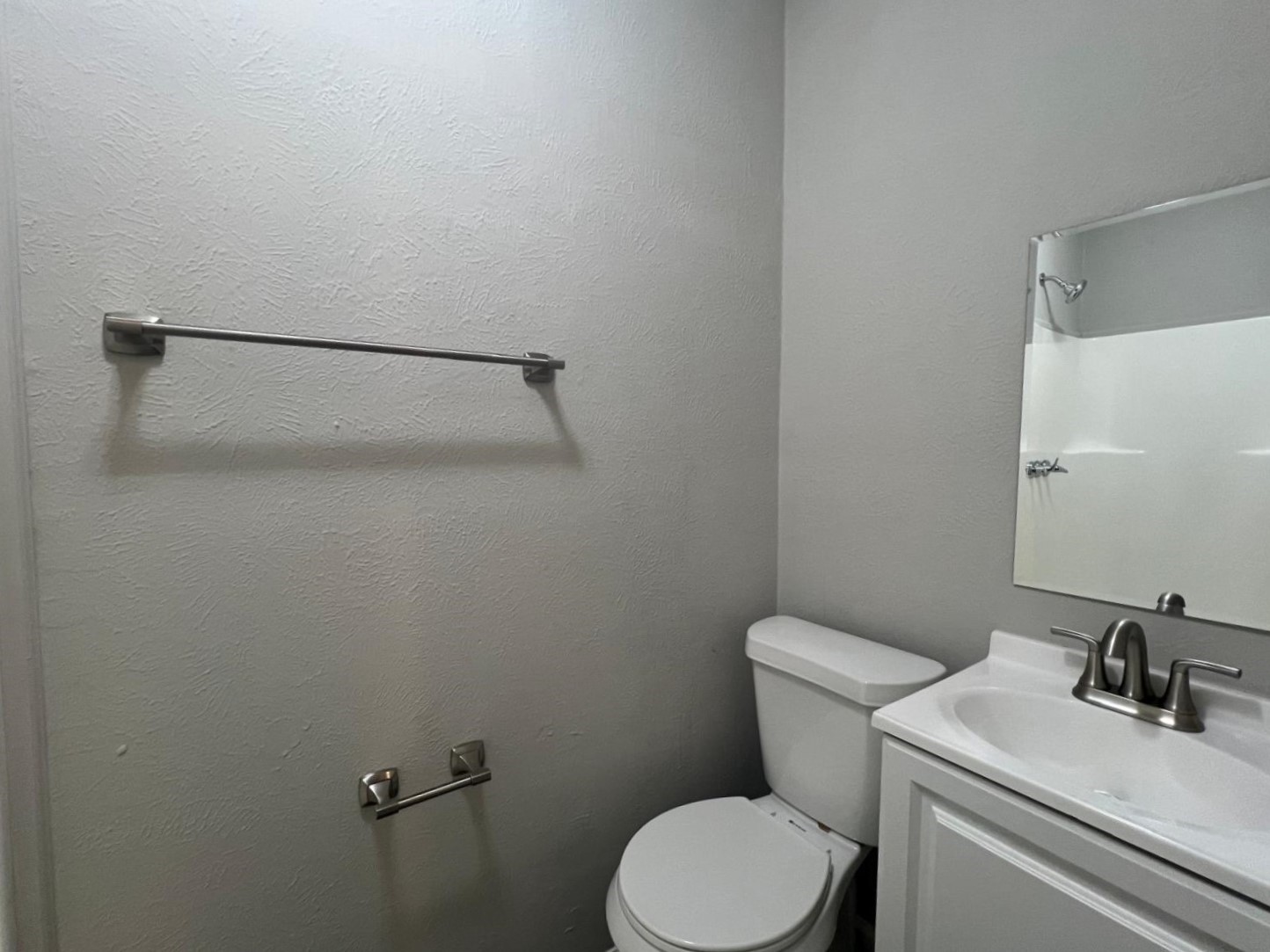 7106 Summer Lane Rosharon, TX 77583 - Photo 7 of 13 a white toilet sitting next to a bathroom sink