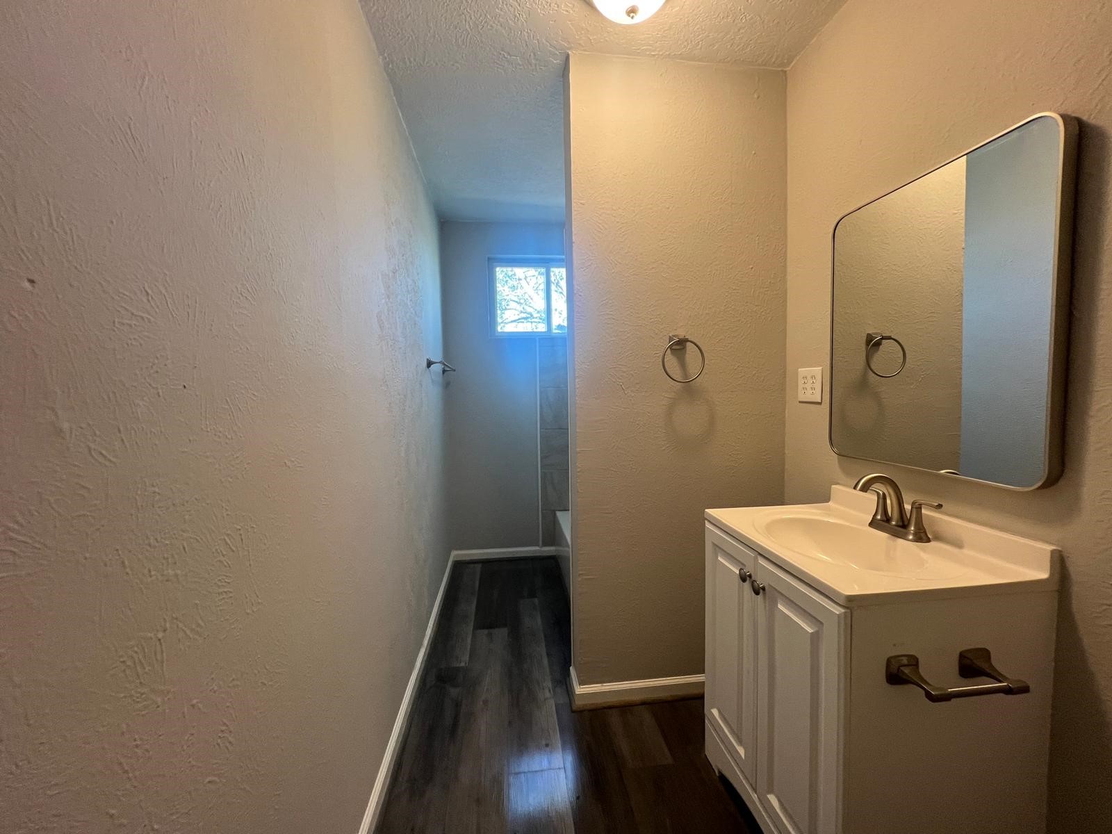 7106 Summer Lane Rosharon, TX 77583 - Photo 9 of 13 a bathroom with a sink and mirror