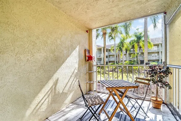 a view of swimming pool with outdoor seating