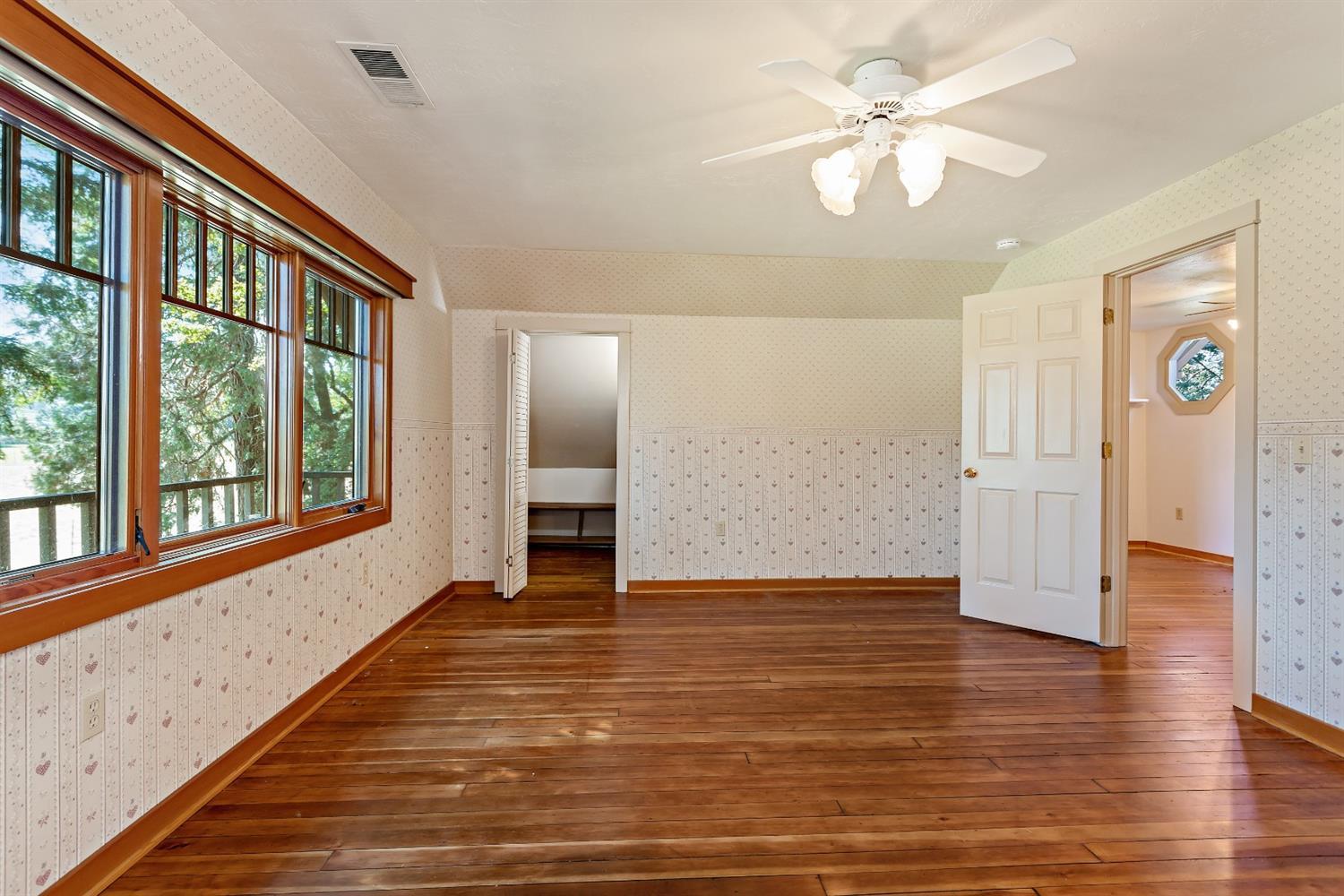 4410 Colver Road Phoenix, OR 97535 - Photo 21 of 35 a view of an empty room with window and wooden floor