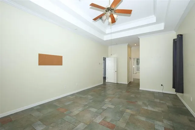 a view of a dining room with furniture and a window