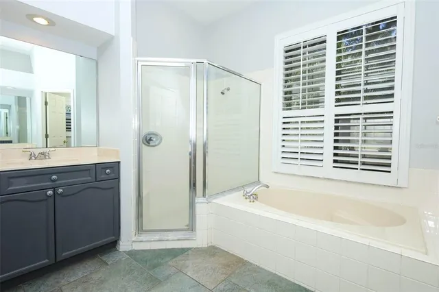 a kitchen with stainless steel appliances granite countertop a refrigerator sink and stove