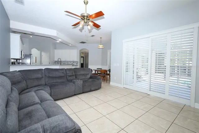 a view of a balcony with floor to ceiling window and wooden floor