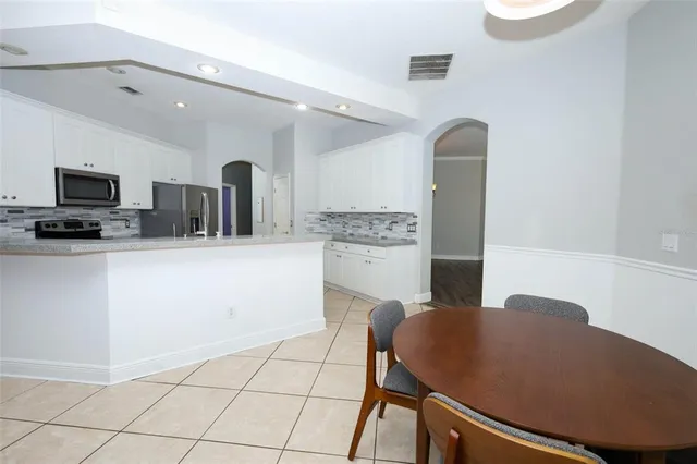 a sign that is sitting in front of a house