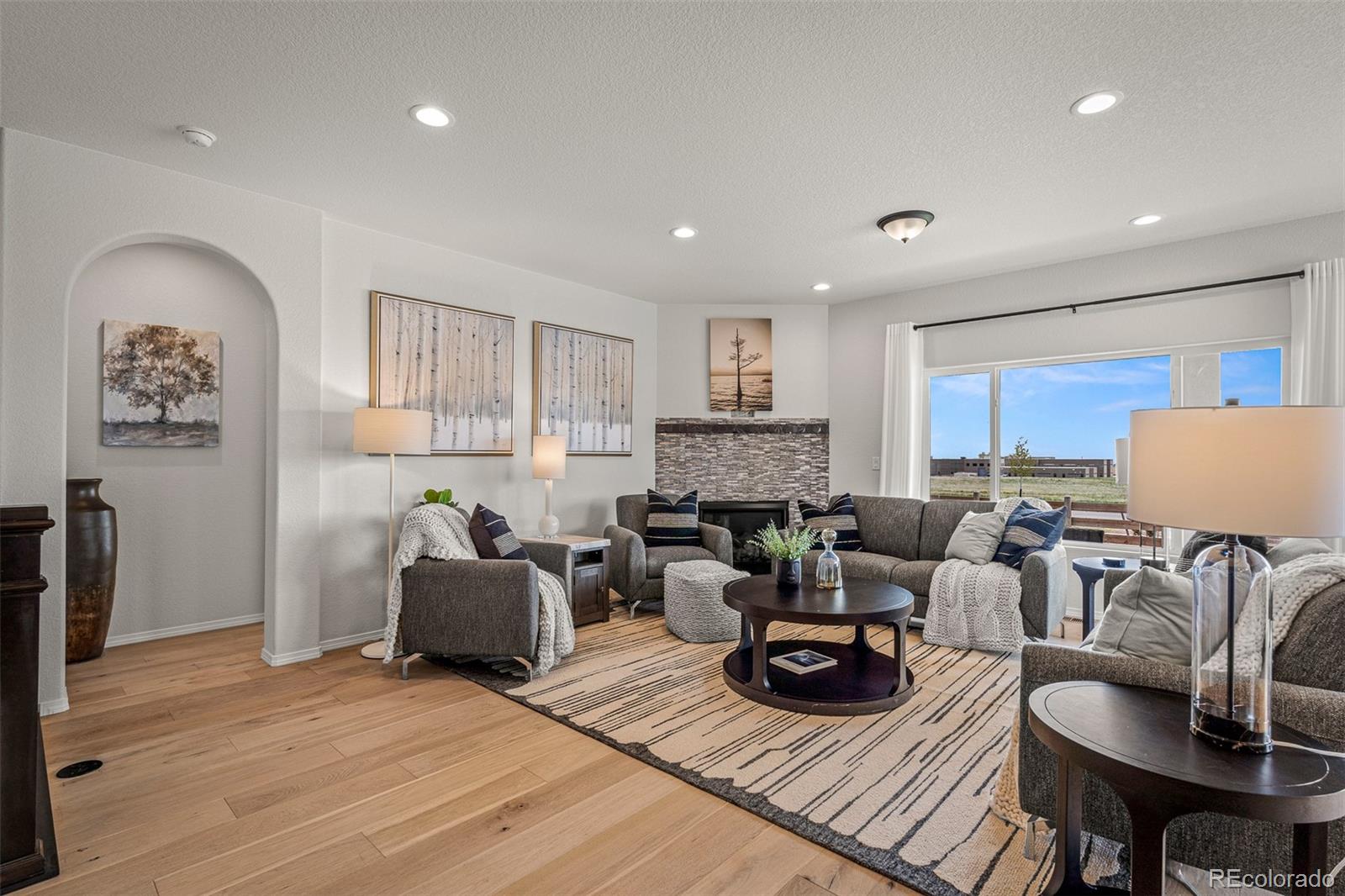 13410 New Ranch Drive Peyton, CO 80831 - Photo 12 of 50 a living room with furniture and a wooden floor