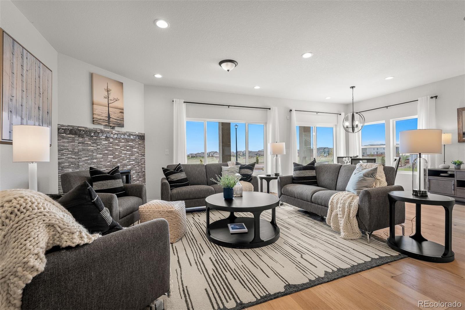 13410 New Ranch Drive Peyton, CO 80831 - Photo 14 of 50 a living room with furniture fireplace and a table