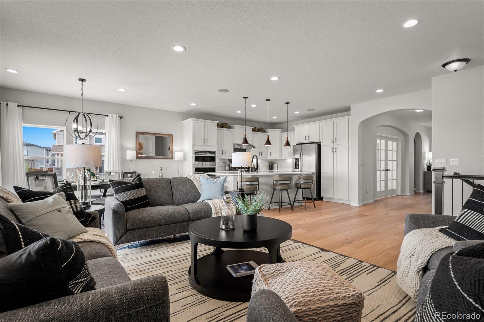 13410 New Ranch Drive Peyton, CO 80831 - Photo 15 of 50 a living room with furniture and view of kitchen
