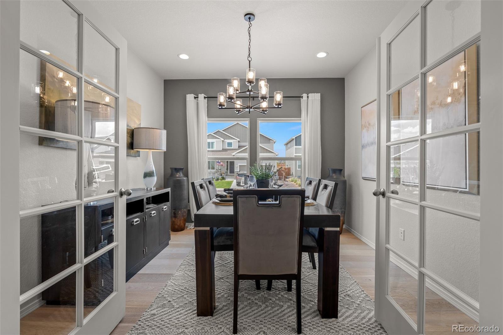 13410 New Ranch Drive Peyton, CO 80831 - Photo 28 of 50 a view of a dining room with furniture window and wooden floor