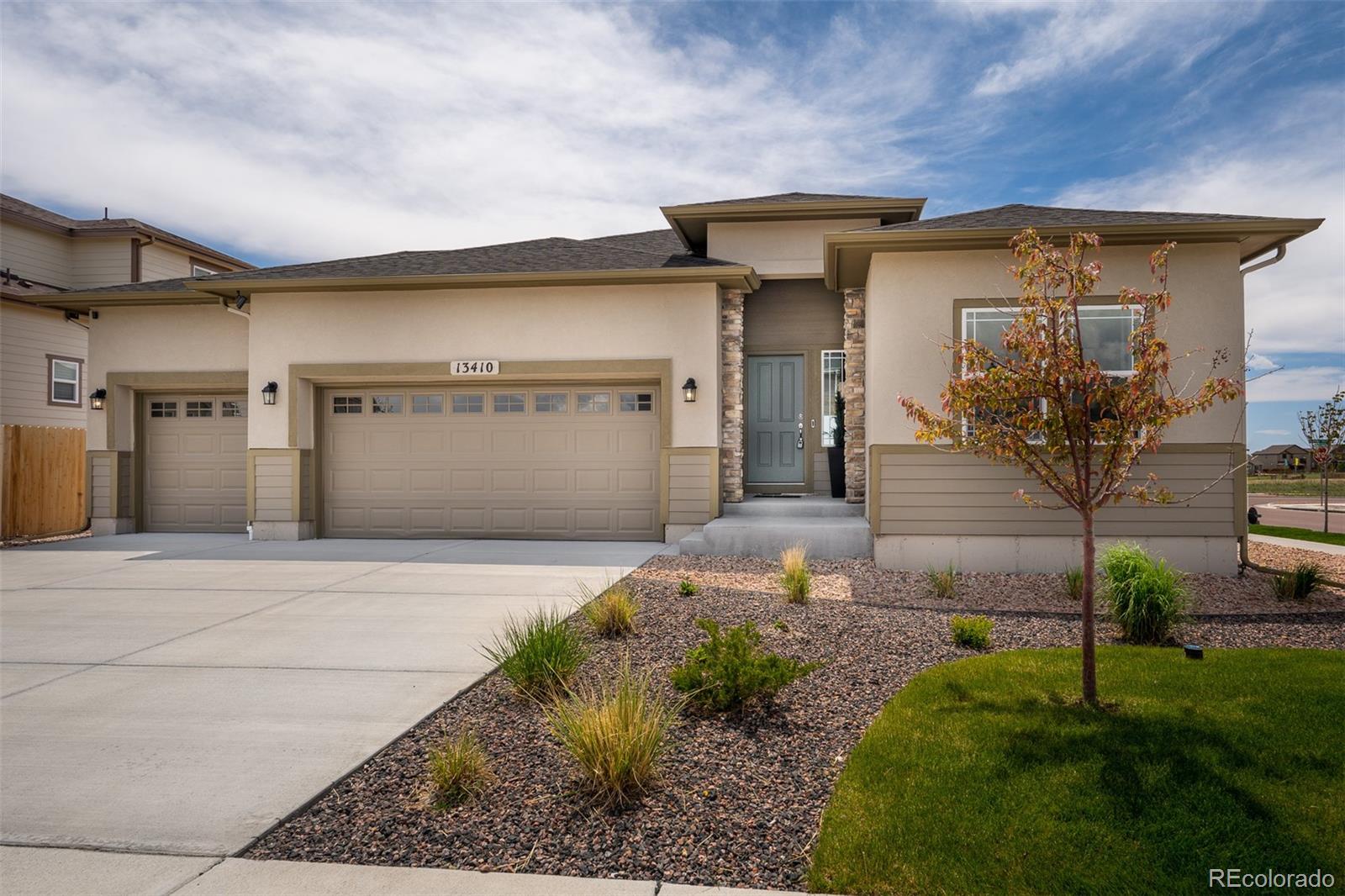 13410 New Ranch Drive Peyton, CO 80831 - Photo 3 of 50 a front view of a house with garden