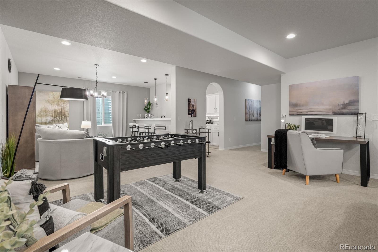 13410 New Ranch Drive Peyton, CO 80831 - Photo 36 of 50 a living room with furniture a rug and kitchen view