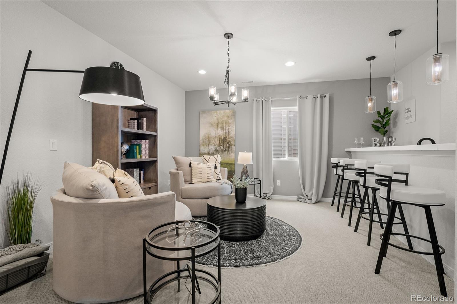 13410 New Ranch Drive Peyton, CO 80831 - Photo 37 of 50 a living room with furniture and a chandelier