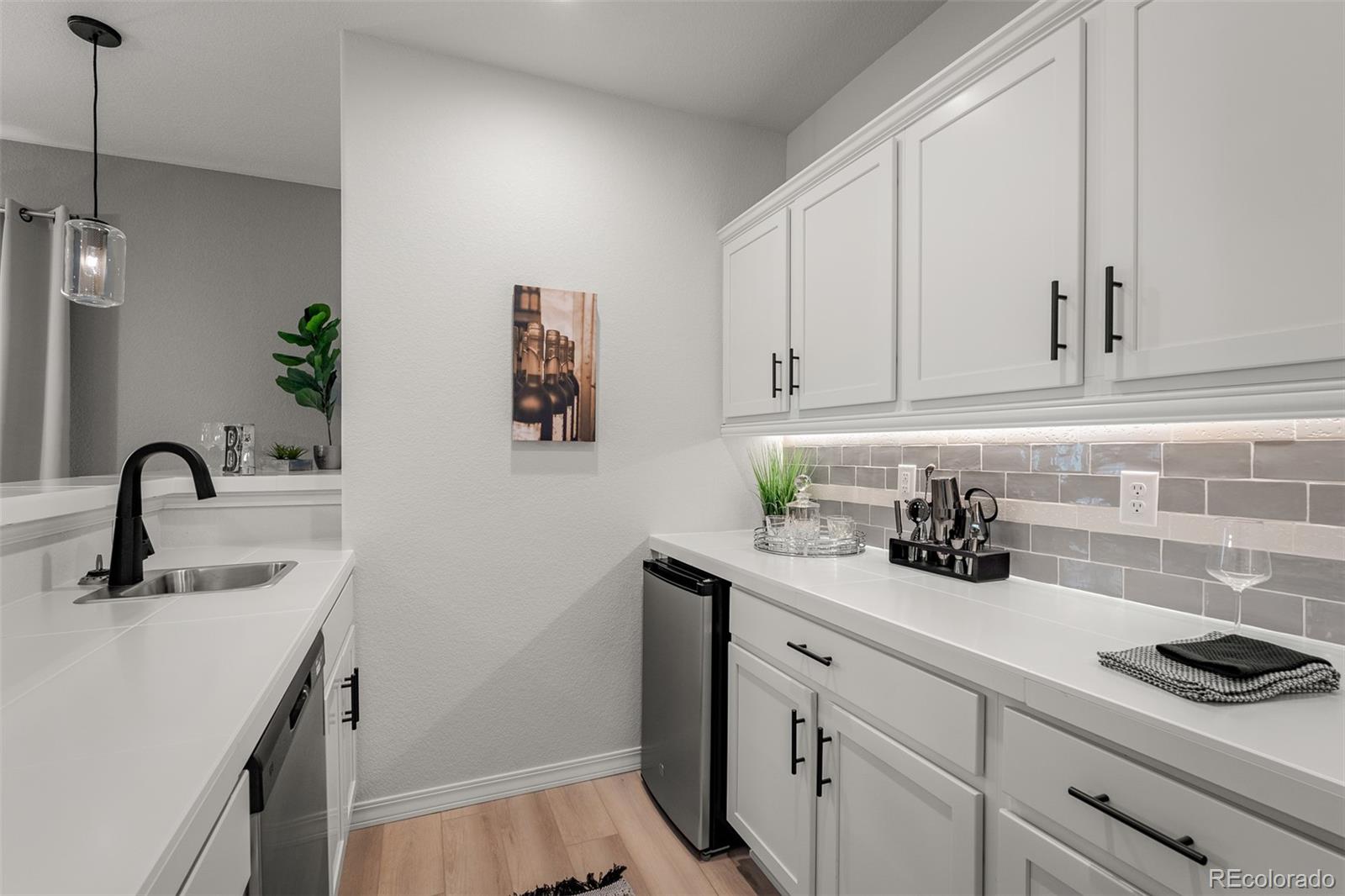 13410 New Ranch Drive Peyton, CO 80831 - Photo 41 of 50 a view of a sink a faucet and cabinets in the kitchen