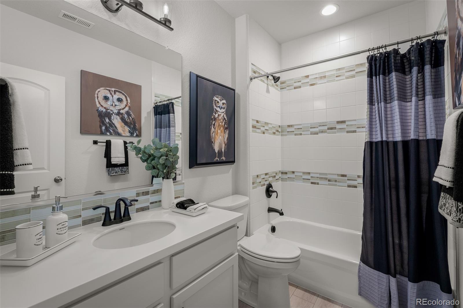 13410 New Ranch Drive Peyton, CO 80831 - Photo 44 of 50 a bathroom with a sink a toilet and shower
