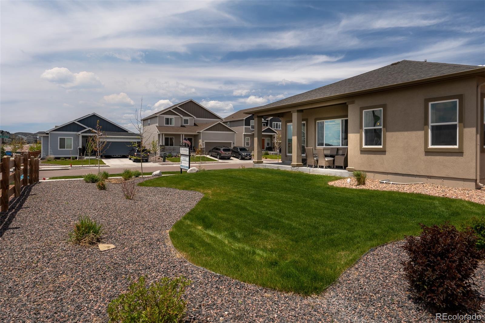 13410 New Ranch Drive Peyton, CO 80831 - Photo 48 of 50 a front view of house with yard and green space
