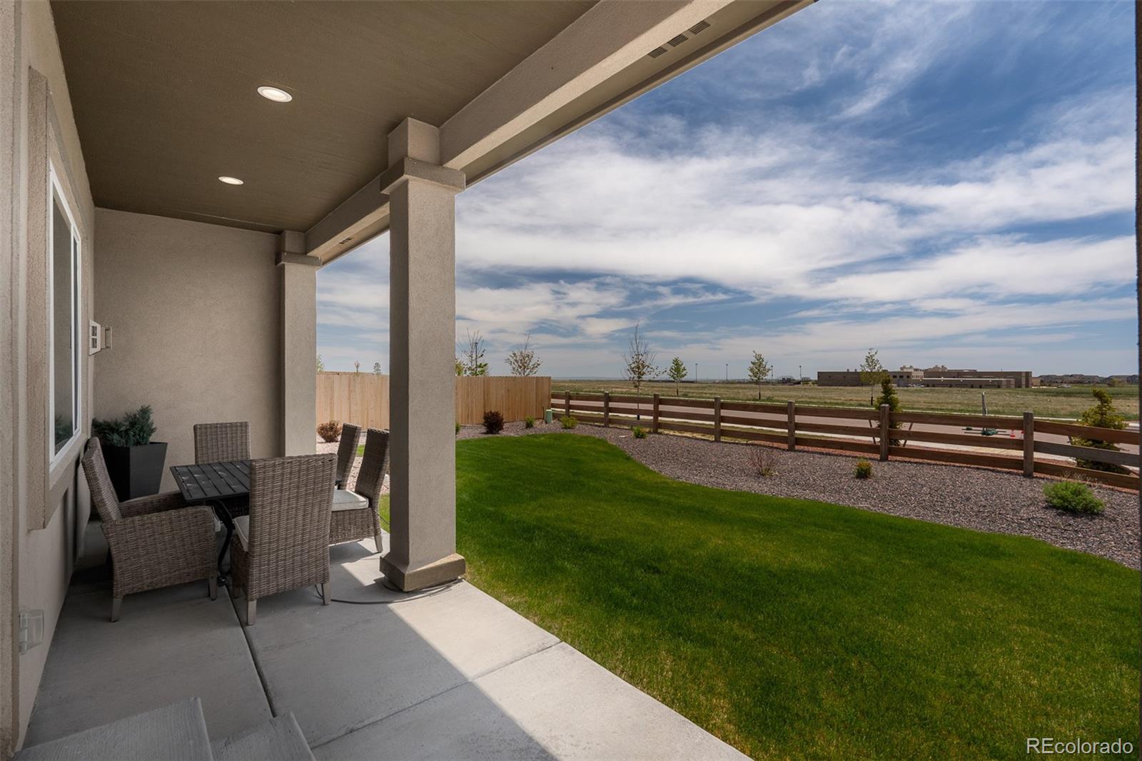 13410 New Ranch Drive Peyton, CO 80831 - Photo 49 of 50 a view of a patio with chairs and a yard