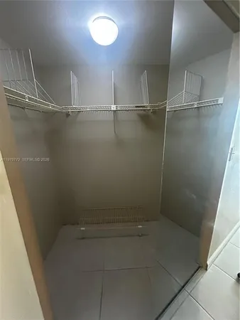 a view of an empty walk in closet