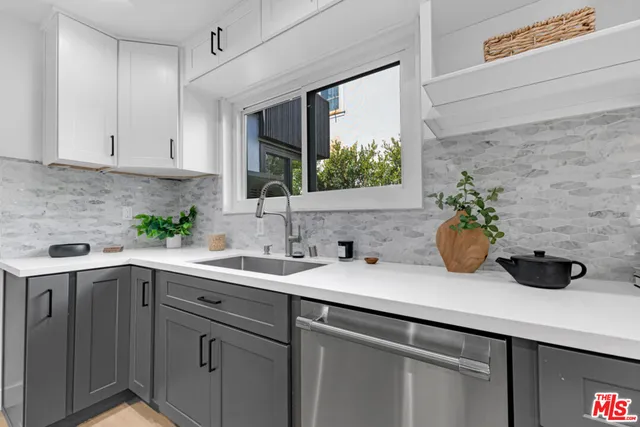 a kitchen with a stove and a microwave