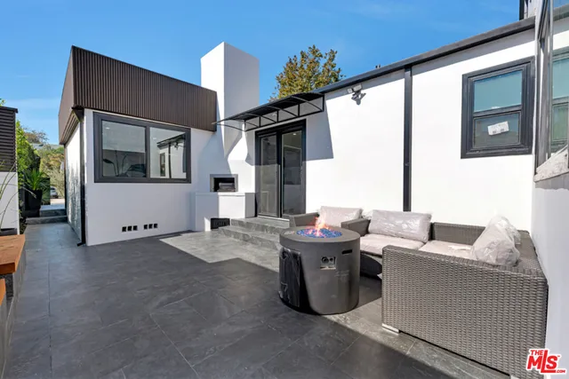 a kitchen with stainless steel appliances a sink window and cabinets