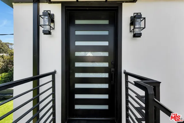 a view of a house with backyard sitting area and garden