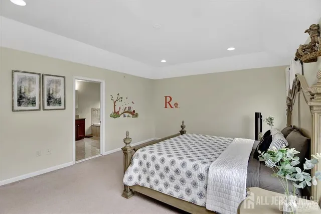 a bedroom with a bed and potted plants with the wooden floor