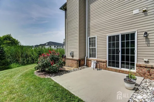 a house with lots of trees in front of it