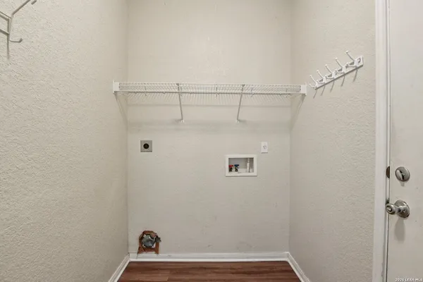 a bathroom with a granite countertop sink a toilet and a mirror