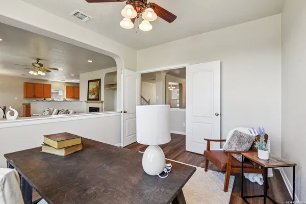 a spacious bedroom with a bed and a ceiling fan