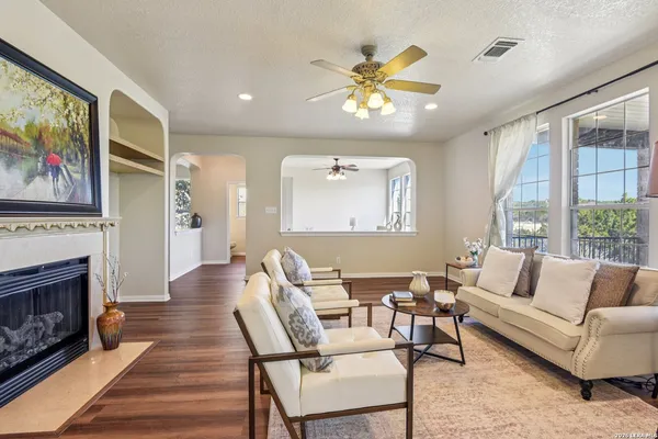 a living room with furniture and a fireplace