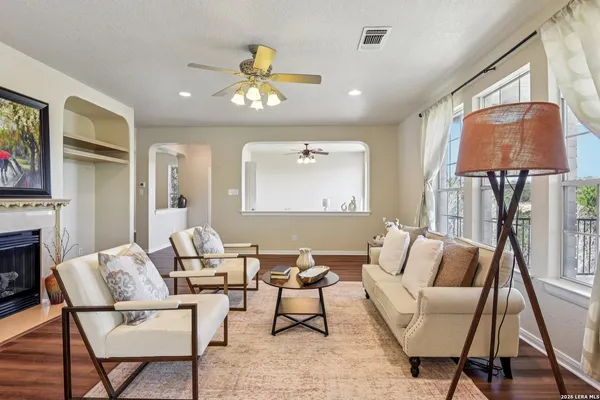 a living room with furniture and a fireplace