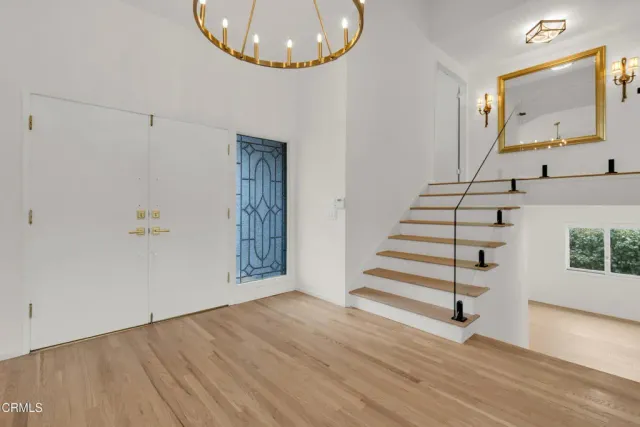a view of an entryway with wooden floor
