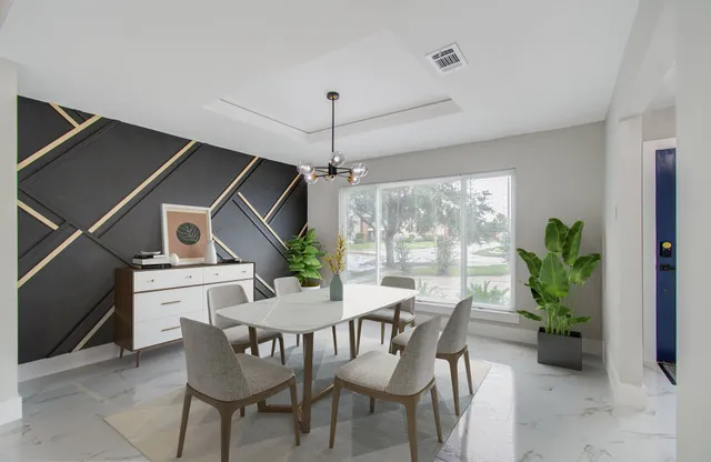 a view of a dining room with furniture window and outside view