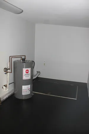 a view of storage and utility room with washer and dryer
