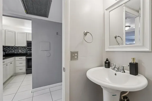 a bathroom with a sink and a mirror